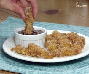 Light and crispy fried churros dipped in a warm, rich chocolate. Perfect for breakfast or an afternoon snack. | www.curiouscuisiniere.com