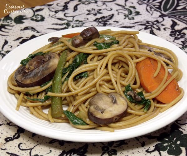 This easy Chinese noodle dish is full of veggies and quick to make than calling for takeout! | www.curiouscuisiniere.com