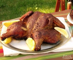 Grilled chicken marinated with lemon, chili peppers, garlic, and herbs. Perfect for your next summer cookout! | www.curiouscuisiniere.com