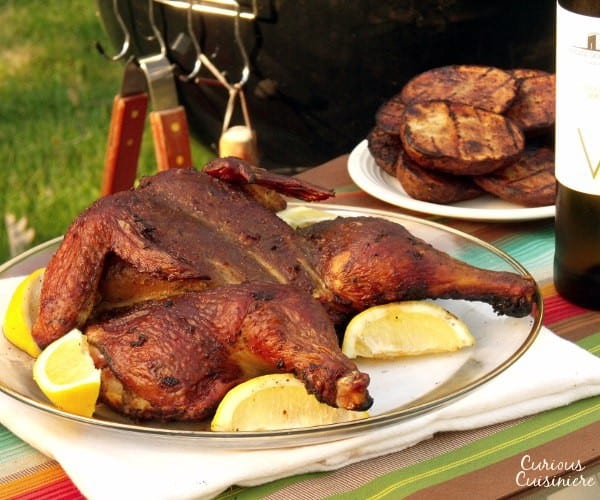 Grilled chicken marinated with lemon, chili peppers, garlic, and herbs. Perfect for your next summer cookout! | www.curiouscuisiniere.com