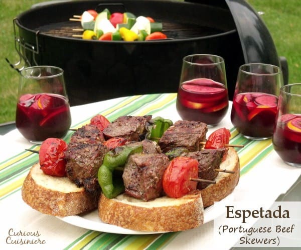 Tender, juicy grilled beef seasoned with garlic and bay, served over thick slices of crusty bread. Big, juicy grill-seared chunks of beef served over thick slices of artisan bread. Espetada, or Portuguese Beef Skewers, is the perfect summer party recipe. | www.CuriousCuisiniere.com 