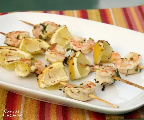 Lemon and parsley create the perfect bright marinade for these summery grilled shrimp. | www.curiouscuisiniere.com
