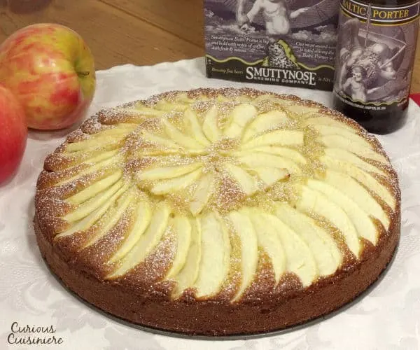 Fluffy and buttery cake topped with apples slices, Apfelkuchen, or German Apple Cake, is a perfect fall dessert. | www.curiouscuisiniere.com