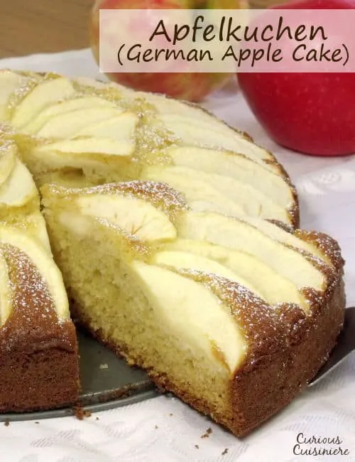 Fluffy and buttery cake topped with apples slices, Apfelkuchen, or German Apple Cake, is a perfect fall dessert. | www.curiouscuisiniere.com