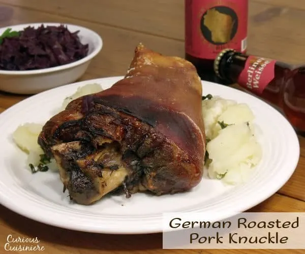 Schweinshaxe, or tender and juicy pork knuckle wrapped in a salty and roasted-crisp skin, is the quintessential Oktoberfest feast, perfect for pairing with a big stein of your favorite beer. | www.curiouscuisiniere.com 