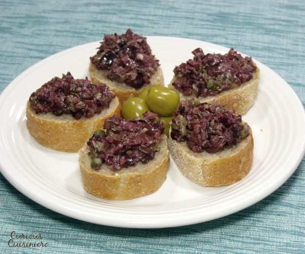Bright olives and capers make up a flavorful South France olive tapenade. The perfect appetizer for your next party! | www.curiouscuisiniere.com