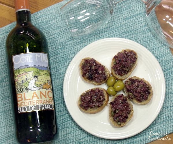 Bright olives and capers make up a flavorful South France olive tapenade. The perfect appetizer for your next party! | www.curiouscuisiniere.com