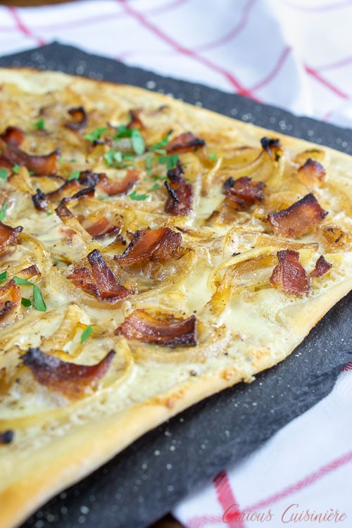 Flammekuchen, French Alsace pizza with bacon and caramelized onions.