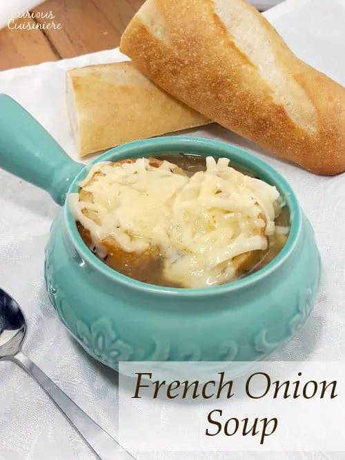Comforting French Onion Soup combines caramelized onions, crisp toast, and gooey cheese for one comforting dish. | www.curiouscuisiniere.com 