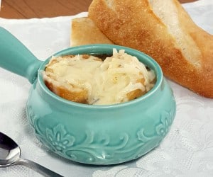 Comforting French Onion Soup combines caramelized onions, crisp toast, and gooey cheese for one comforting dish. | www.curiouscuisiniere.com