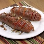 Hasselback potatoes make for a beautifully presented holiday side dish, and using sweet potatoes makes them the perfect addition to any Thanksgiving table! | www.curiouscuisiniere.com