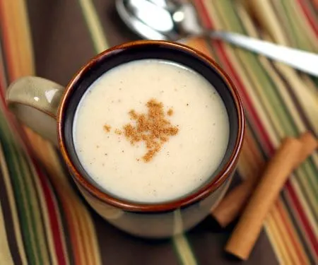 A warming drink perfect for winter, this Mexican Atole recipe is full of the comforting flavors of vanilla and cinnamon. | www.CuriousCuisiniere.com