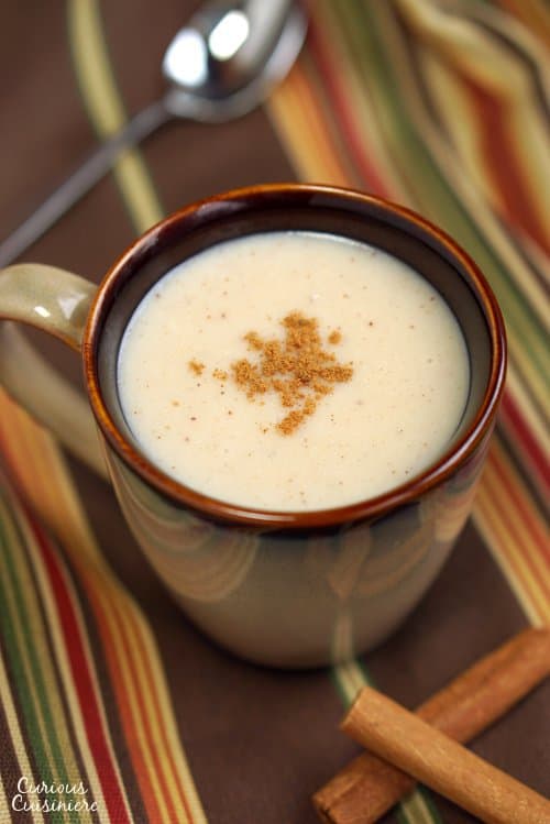 A warming drink perfect for winter, this Mexican Atole recipe is full of the comforting flavors of vanilla and cinnamon. | www.CuriousCuisiniere.com