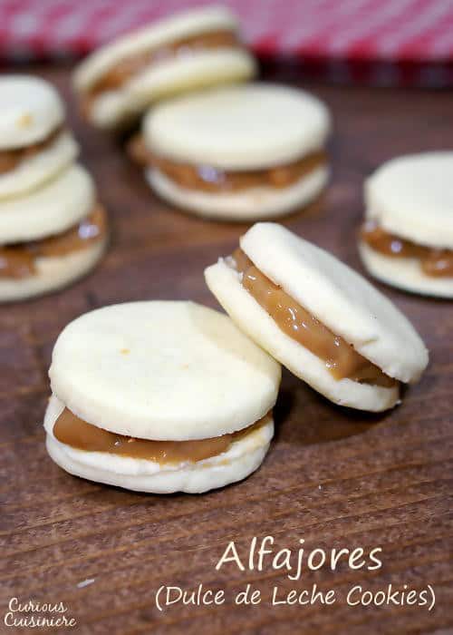 Creamy dulce de leche, sandwiched between two crisp and buttery shortbread cookies makes these Argentinian Alfajores a recipe worth indulging in for the holidays. | www.curiouscuisiniere.com