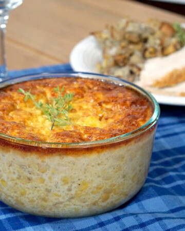 If you're sick of the same old corn side dish, try this recipe for Corn Pudding. This dish, with Native American origins is like a cross between creamed corn and a souffle. | www.curiouscuisiniere.com