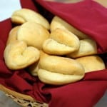 This recipe for soft and buttery Parker House Rolls makes a classic American dinner roll, perfect for a holiday or any occasion. | www.curiouscuisiniere.com