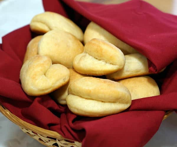 This recipe for soft and buttery Parker House Rolls makes a classic American dinner roll, perfect for a holiday or any occasion. | www.curiouscuisiniere.com