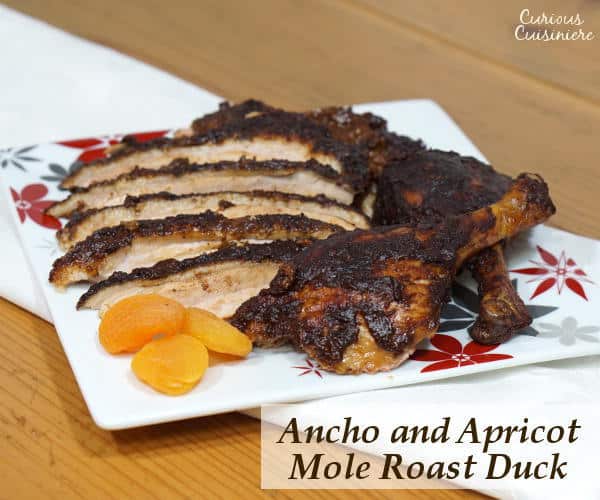 Change up your holiday dinner routine with this recipe for mole seasoned Roast Duck served with a rich Ancho and Apricot Mole Sauce. | www.curiouscuisiniere.com