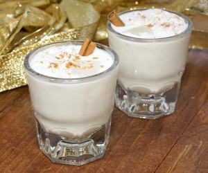 Rum and coconut milk give the Puerto Rican twist on eggnog a Caribbean flair. Smooth and creamy, this Coquito recipe is an easy drink to whip up for your holiday party guests! | www.curiouscuisiniere.com