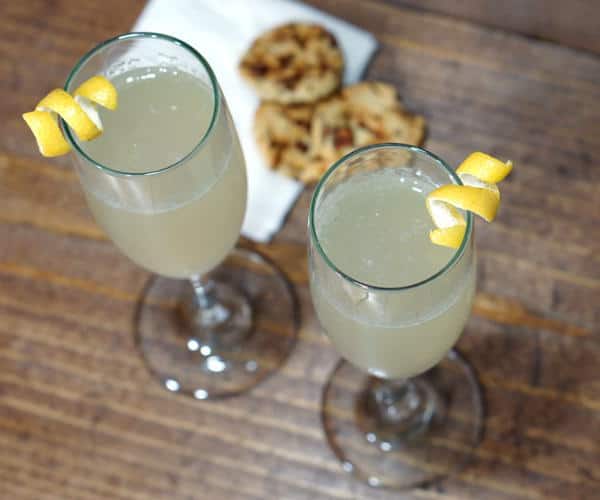 With a fun play of sweet, sour, and bubbles, this recipe for a French 75 cocktail is perfect for any celebration! | www.curiouscuisiniere.com