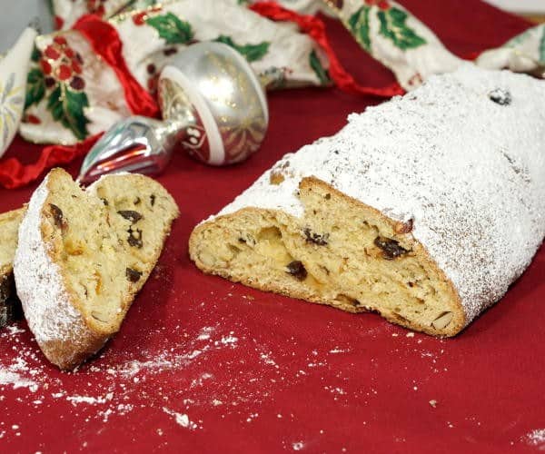 This recipe for rich, fruit-studded Stollen makes a festive and tasty Christmas bread, perfect for celebrating with family or bringing to a holiday party! | www.curiouscuisiniere.com