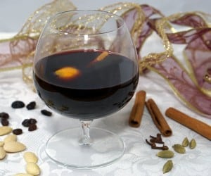 This recipe for Swedish Glögg creates the perfectly spiced, warming drink for serving at holiday party or just relaxing and enjoying the season. | www.curiouscuisiniere.com