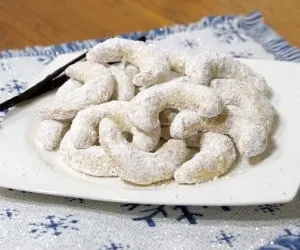Crisp and buttery with a nutty, almond flavor, this recipe for delicate Vanillekipferl, or Austrian Vanilla Crescent Cookies, creates cookies that look pretty on a platter and are sure to be a hit at your holiday party. www.curiouscuisiniere.com