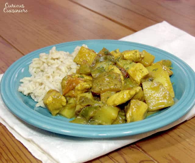 This light and bright African Coconut Chicken Curry is a creamy and comforting dish: the perfect recipe for serving over steamed rice. | www.curiouscuisiniere.com