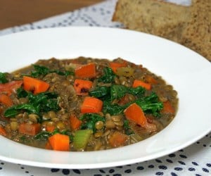 This hearty Lentil Soup with Kale is a Brazilian staple on New Year's Day when eating lentils provides good luck for prosperity in the coming year. | www.curiouscuisiniere.com