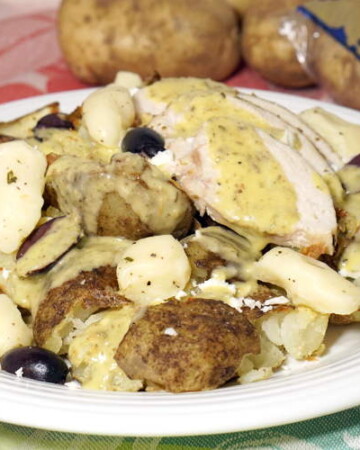 The classic Canadian dish takes on lemon, oregano and herbed cheese curds in this fun Greek Chicken Poutine fusion recipe. | www.curiouscuisiniere.com