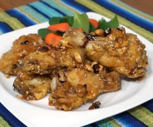 Dak Kang Jung, or Korean Sweet and Spicy Chicken Wings are the perfect combo of sticky sweetness and red chili spice, this recipe is perfect for your game day appetizer! | www.CuriousCuisiniere.com