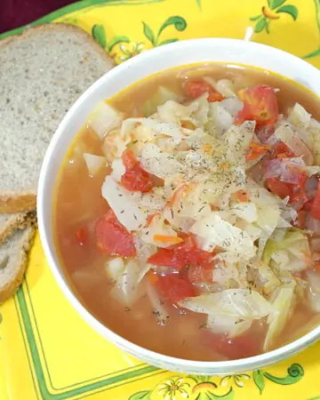 Shchi uses beef broth for a rich and robust flavor, making this Russian version different from other Cabbage Soup recipes. | www.curiouscuisiniere.com