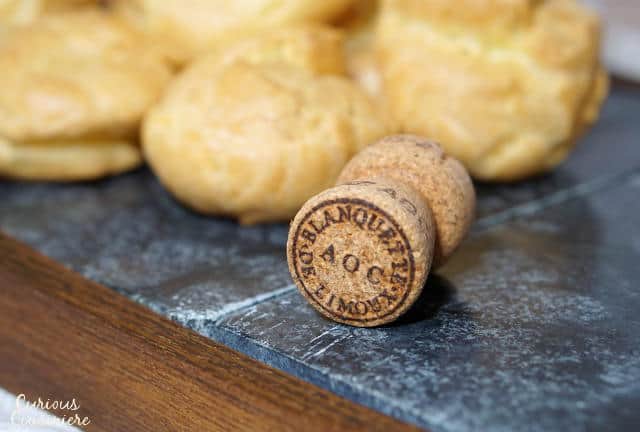 Gougères, or French Cheese Puffs, are light and airy, cheese-filled pastry bites with a crisp outside and a soft, buttery inside. Once you make them, you'll want to serve this recipe as an appetizer at every party! | www.CuriousCuisiniere.com