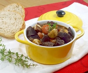 Beef, braised in deep red wine, makes the classic French Boeuf Bourguignon a recipe for the perfect winter comfort food. | www.CuriousCuisiniere.com