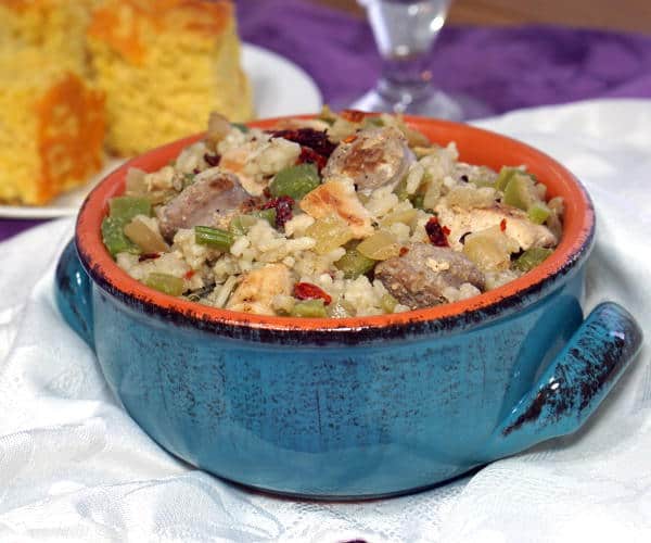Cajun Chicken and Sausage Jambalaya is a smoky and flavorful one pot meal. Whether you like it spicy or mild, this recipe is sure to a favorite for family dinners and parties. | www.CuriousCuisiniere.com