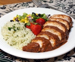 Light and bright strawberries take on a savory depth in this recipe for Chicken with Strawberry Mole Sauce. If you love mole and strawberries, you need to try this unique twist on the classic Mexican mole. | www.CuriousCuisiniere.com