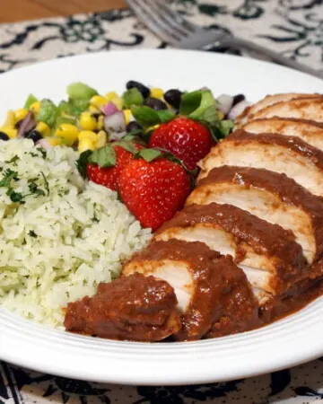 Light and bright strawberries take on a savory depth in this recipe for Chicken with Strawberry Mole Sauce. If you love mole and strawberries, you need to try this unique twist on the classic Mexican mole. | www.CuriousCuisiniere.com