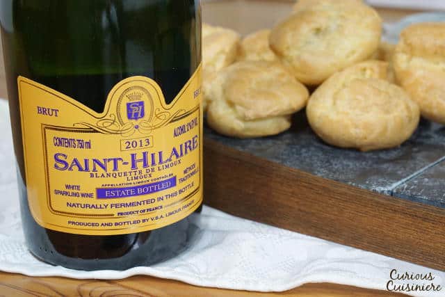 Gougères, or French Cheese Puffs, are light and airy, cheese-filled pastry bites with a crisp outside and a soft, buttery inside. Once you make them, you'll want to serve this recipe as an appetizer at every party! | www.CuriousCuisiniere.com