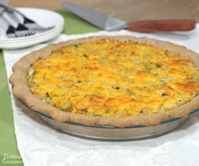 British Homity Pie brings the cheesy potato goodness of a loaded baked potato together with a hearty whole wheat crust. It is the perfect recipe for an easy, vegetarian dinner. | www.CuriousCuisiniere.com