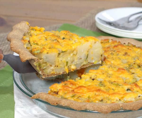 British Homity Pie brings the cheesy potato goodness of a loaded baked potato together with a hearty whole wheat crust. It is the perfect recipe for an easy, vegetarian dinner. | www.CuriousCuisiniere.com