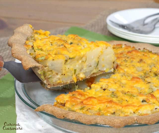 British Homity Pie brings the cheesy potato goodness of a loaded baked potato together with a hearty whole wheat crust. It is the perfect recipe for an easy, vegetarian dinner. | www.CuriousCuisiniere.com