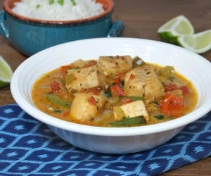 A light and tropical fish stew, Moqueca brings coconut milk and citrus together in a tasty Brazilian dinner recipe. | www.CuriousCuisiniere