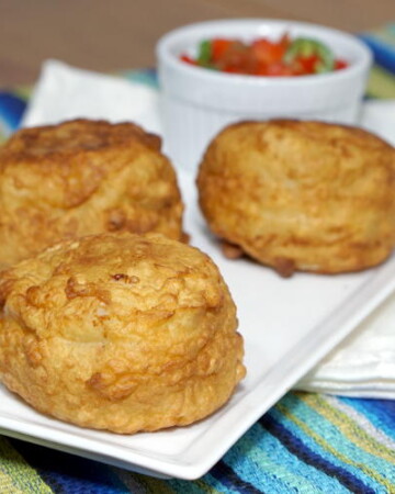 The Colombian version of Papas Rellenas stuffs a flavorful beef and rice mixture inside a creamy, mashed potato shell that is fried to golden brown. | www.CuriousCuisiniere.com
