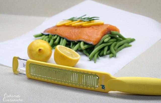This quick and healthy Salmon en Papillote brings light lemon and earthy rosemary together in a beautifully steamed package for a dinner recipe that is simple to prepare and easy to clean up. | www.CuriousCuisiniere.com