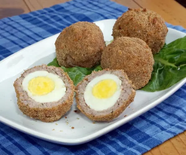 Avoid the deep fryer with these Baked Scotch Eggs, this easy recipe is perfect for a fun lunch or picnic. | www.CuriousCuisiniere.com