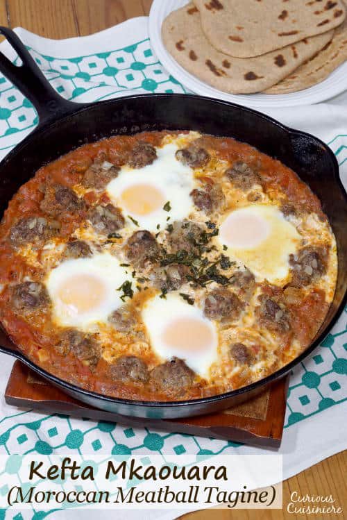 Kefta Mkaouara is a Moroccan dish made up of tiny meatballs, simmered in a flavorful tomato sauce and crowned with poached eggs. | www.CuriousCuisiniere.com