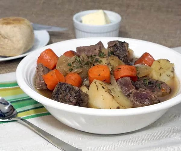 This slow cooker version of a Traditional Irish stew brings simple ingredients together to create an incredibly comforting recipe. | www.CuriousCuisiniere.com