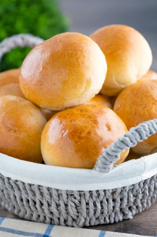 Baked Piroshki - Russian Stuffed Rolls in a serving basket