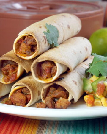 Baked Flautas combine a crisp flour tortilla shell with a flavorful pork filling to create a lighter version of this classic snack. | www.CuriousCuisiniere.com
