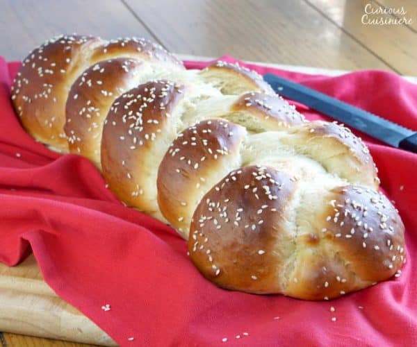 The Jewish braided bread, Challah, is light and fluffy egg bread with a glowing crust. It is perfect for special celebrations, weeknight dinners, and everything in between. | www.CuriousCuisiniiere.com